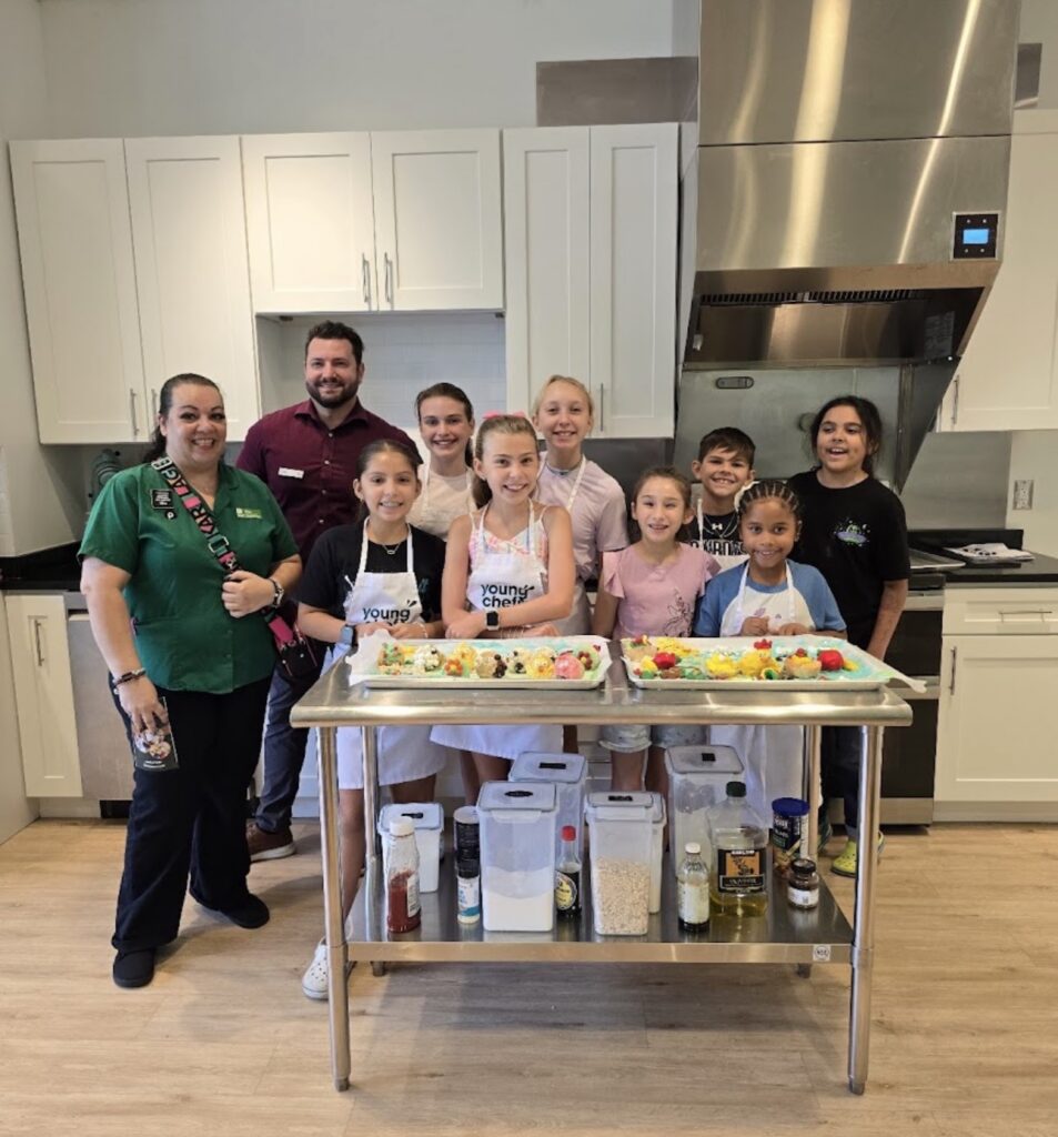 Hands-on cooking class group photo at Young Chefs Academy in Maitland FL