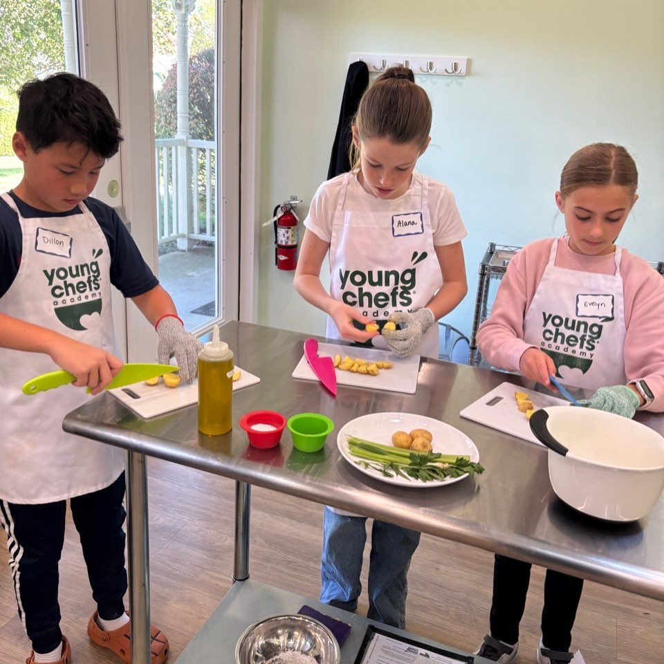 Kids learning knife skills in hands-on cooking class at Young Chefs Academy Yardley PA