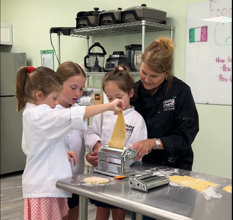 Young Chefs Academy Charleston students making fresh pasta during kids cooking class