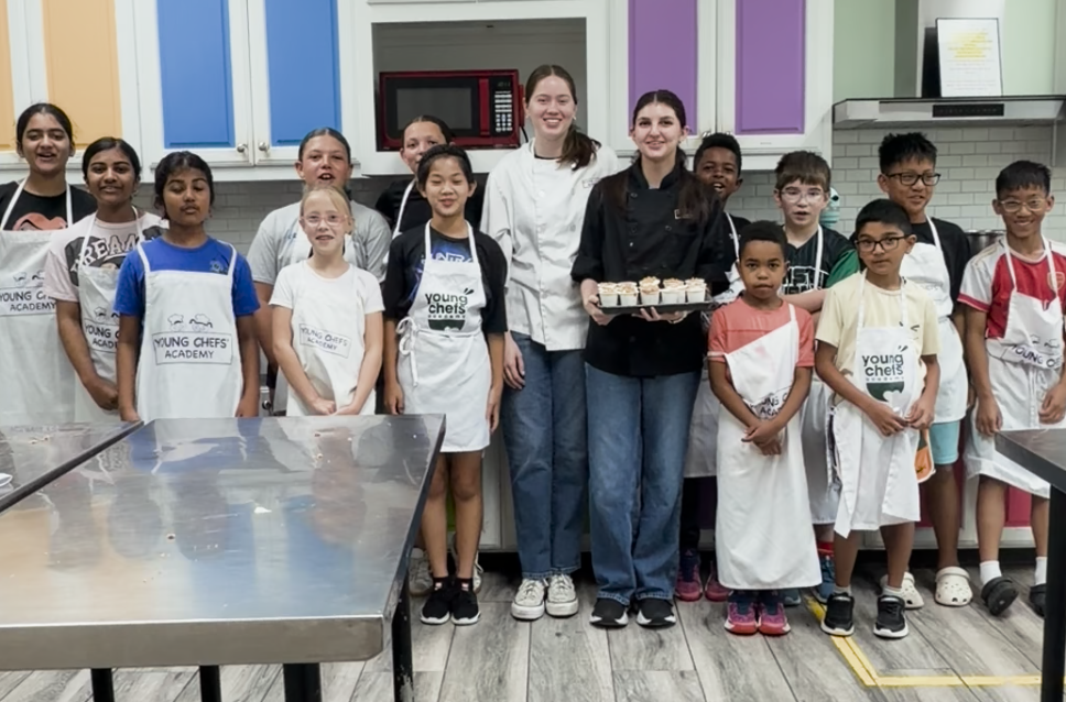 Young Chefs Academy Frisco students participating in kids cooking classes and learning kitchen safety